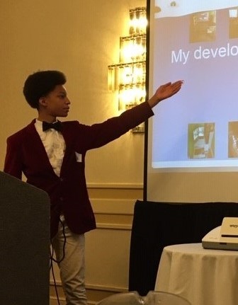 Student Kevin, pictured here giving a presentation at a TPS Collaborators Event in August